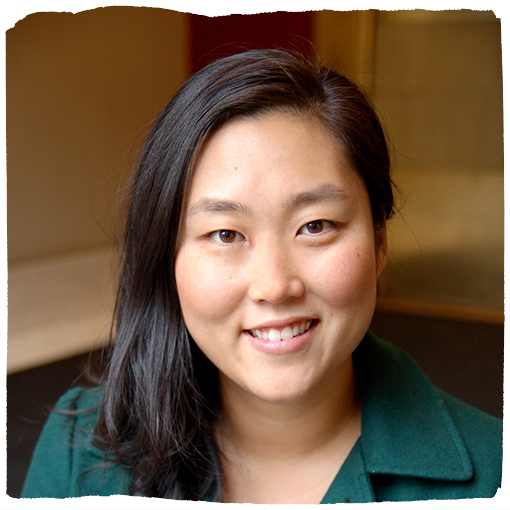 Monica Cho-Brewer wears an emerald green, collared shirt.